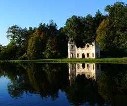 A-peaceful-view-across-the-water-of-Painshills-ruined-abbeyresize