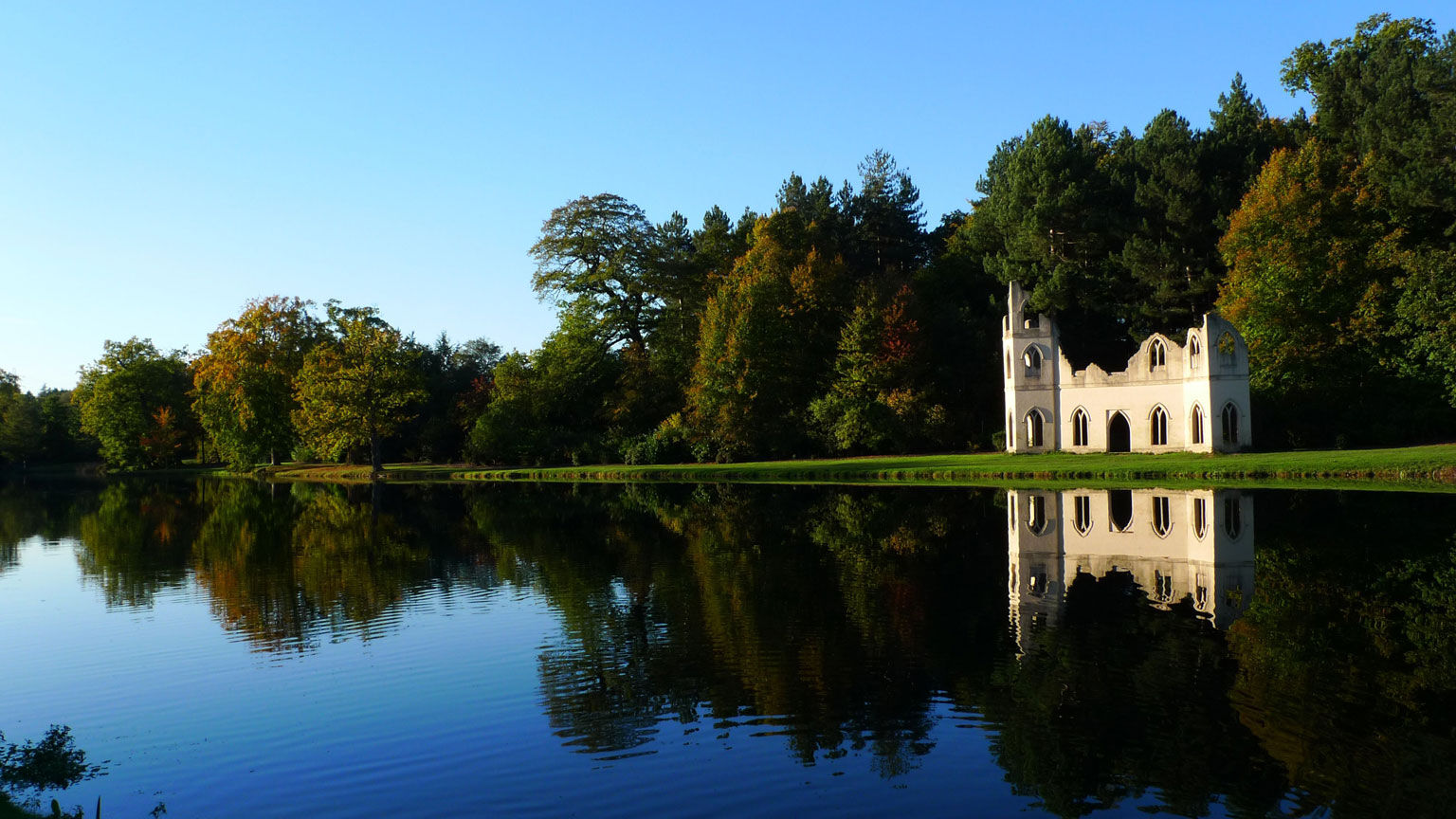 A peaceful view across the water of Painshill's ruined abbey, courtesy of Fred Holmes (Painshill)