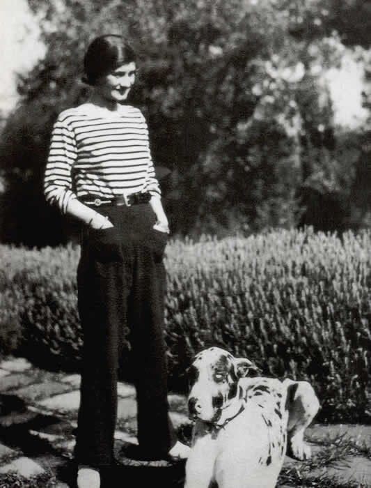 Chanel wearing a sailor's jersey and trousers 1928