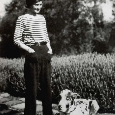 Chanel wearing a sailor's jersey and trousers 1928